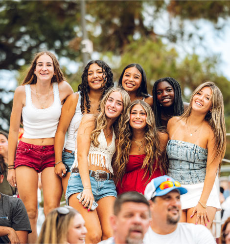 group of girlfriends at the Folsom pro rodeo smiling at the camera